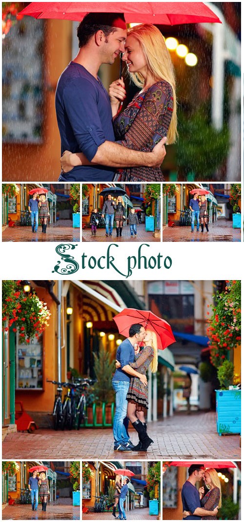 Couple with red umbrella - stock photo